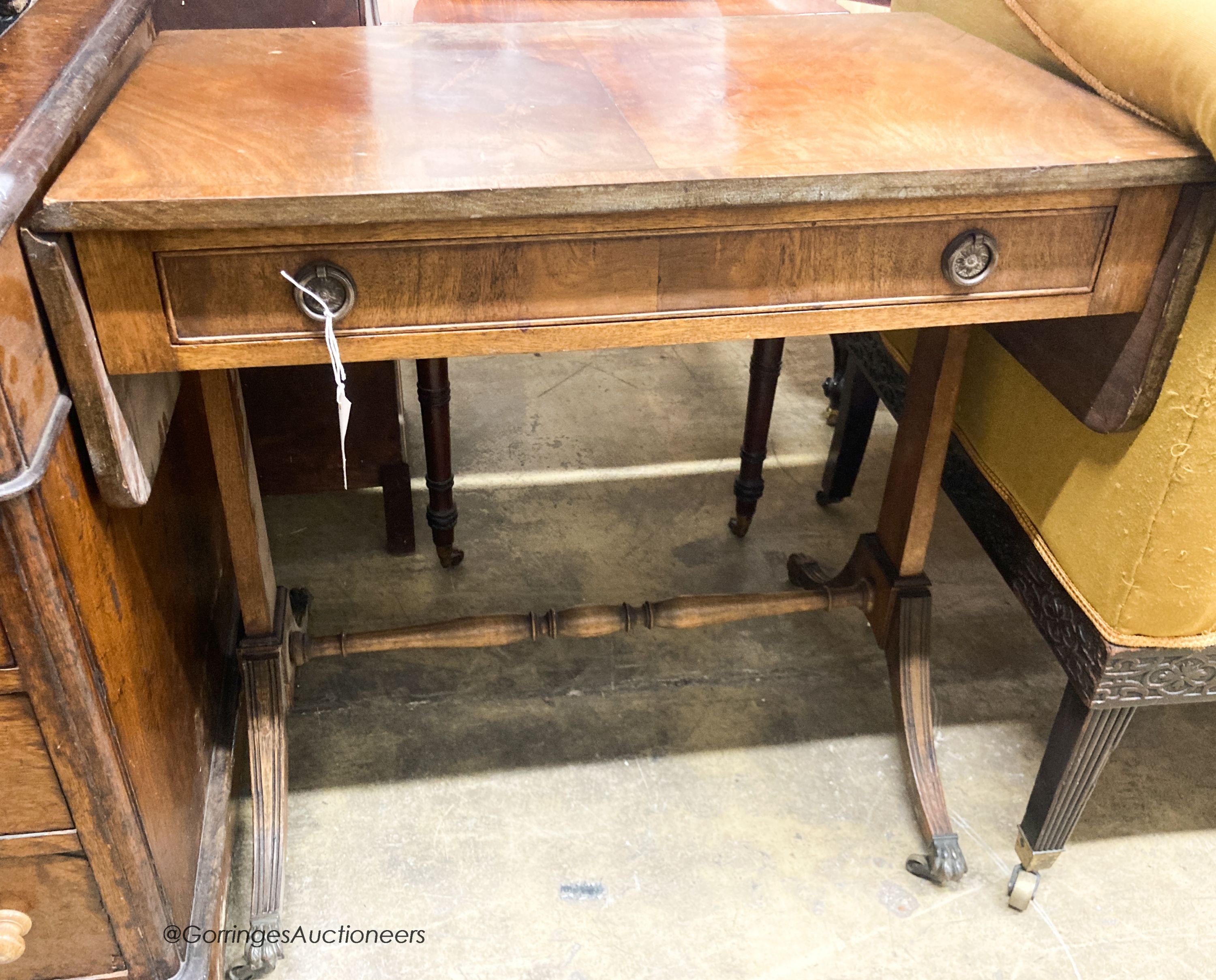 A 1920's reproduction mahogany sofa table, W.74cm H.47cm H.73cm